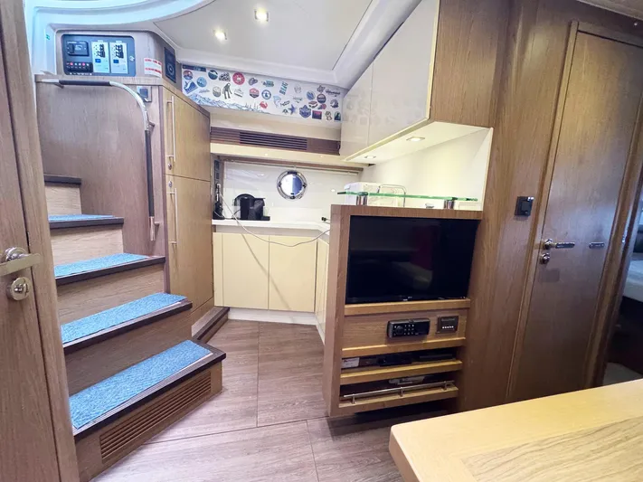 Wanderlust Yacht Photos Pics Interior of 2015 Beneteau Gran Turismo 44 yacht, featuring modern kitchen and entertainment area.