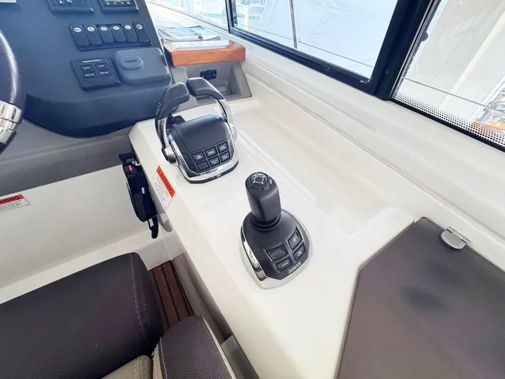Wanderlust Yacht Photos Pics Control panel of 2015 Beneteau Gran Turismo 44 yacht with joystick and throttle.