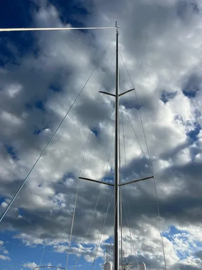 Encore Yacht Photos Pics Sailboat mast against a cloudy sky, J Boats J/95, 2011 model.