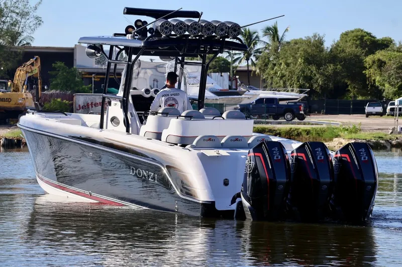  Yacht Photos Pics 2012 Donzi 38 ZF Open boat with four powerful outboard engines on the water.
