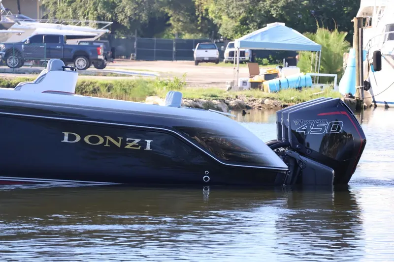  Yacht Photos Pics 2012 Donzi 38 ZF Open boat with Racing 450 engine on calm water.