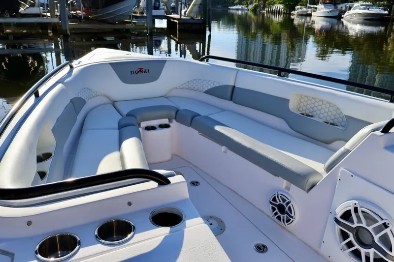  Yacht Photos Pics Luxurious seating on a 2012 Donzi 38 ZF Open boat, docked by the water.