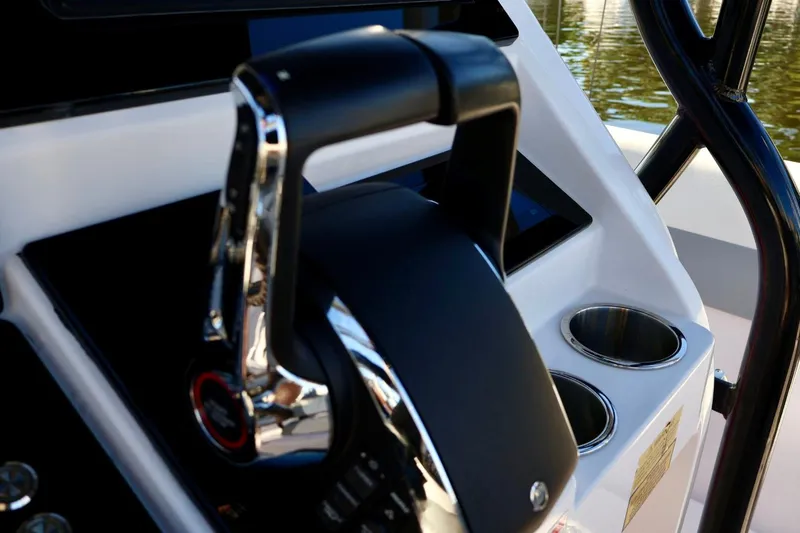  Yacht Photos Pics Close-up of 2012 Donzi 38 ZF Open boat throttle and cup holders.