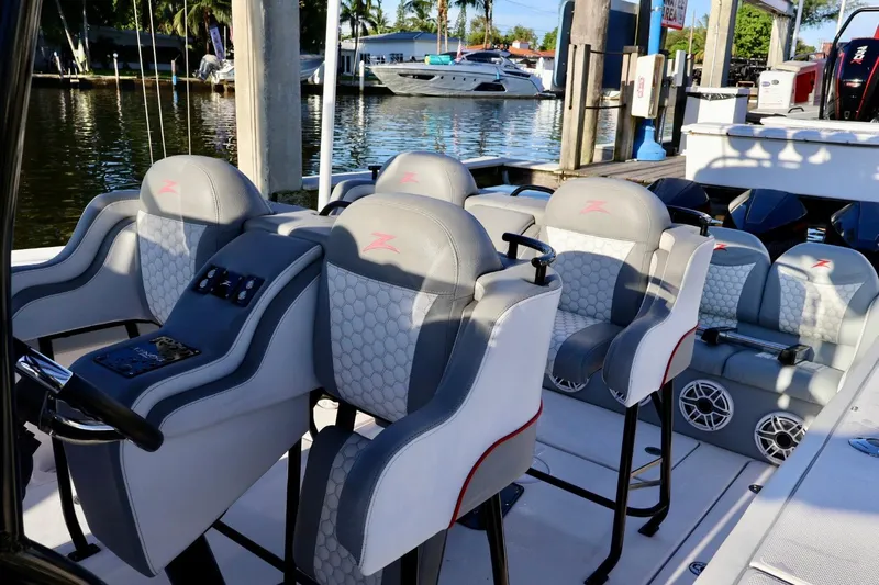  Yacht Photos Pics 2012 Donzi 38 ZF Open boat interior with stylish seating and control panel.