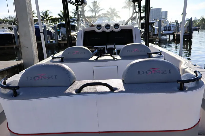  Yacht Photos Pics 2012 Donzi 38 ZF Open boat interior with branded seating at marina.