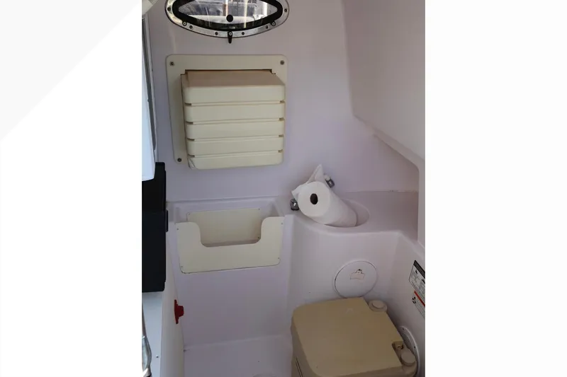  Yacht Photos Pics Interior of 2012 Donzi 38 ZF Open boat featuring compact bathroom amenities.