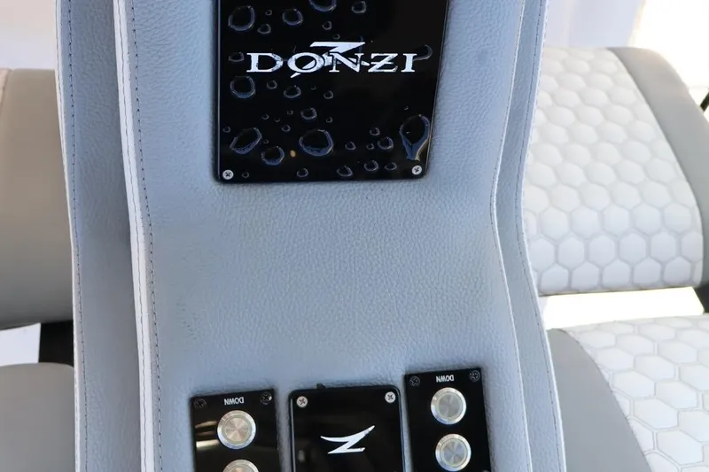  Yacht Photos Pics Interior detail of 2012 Donzi 38 ZF Open boat, featuring branded upholstery and controls.