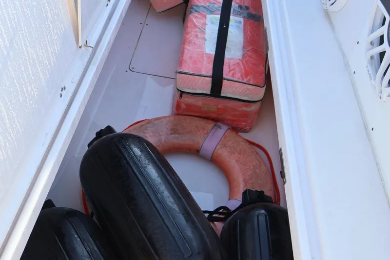  Yacht Photos Pics Storage compartment of 2012 Donzi 38 ZF Open with life jackets and fenders.