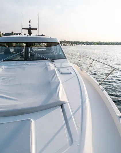 Namari Yacht Photos Pics 2022 Riviera 6000 Sport Yacht Platinum on calm water, showcasing sleek design and luxury features.