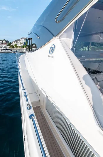 Namari Yacht Photos Pics 2022 Riviera 6000 Sport Yacht Platinum on water, showcasing sleek design and luxury features.