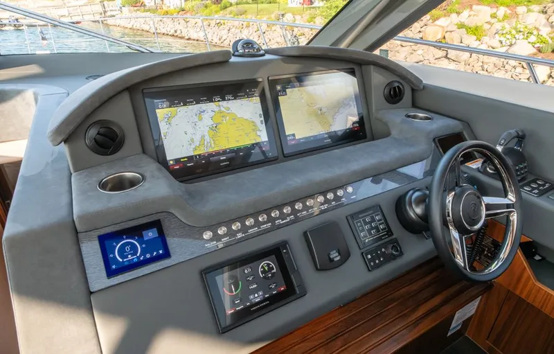 Namari Yacht Photos Pics 2022 Riviera 6000 Sport Yacht Platinum helm with advanced navigation displays and controls.