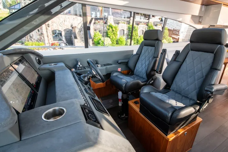 Namari Yacht Photos Pics Interior of 2022 Riviera 6000 Sport Yacht Platinum with luxurious seating and modern controls.