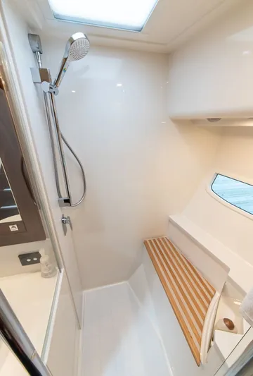 Namari Yacht Photos Pics Luxurious shower area in 2022 Riviera 6000 Sport Yacht Platinum.
