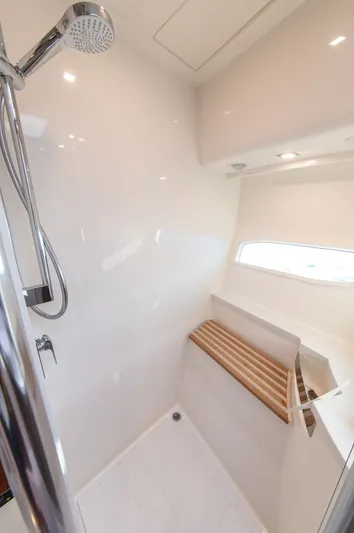 Namari Yacht Photos Pics Shower area in 2022 Riviera 6000 Sport Yacht Platinum, featuring sleek design and modern fixtures.