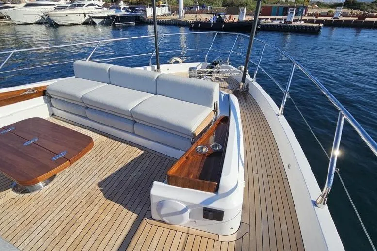  Yacht Photos Pics Luxurious 2024 Azimut Fly 68 yacht deck with elegant seating and wooden accents.