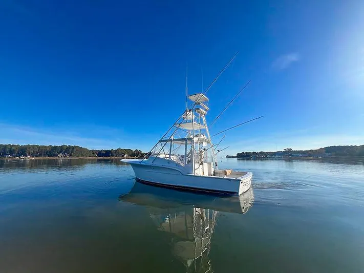 Precedent Yacht Photos Pics 1998 Jersey Cape 36 Express boat on calm water.