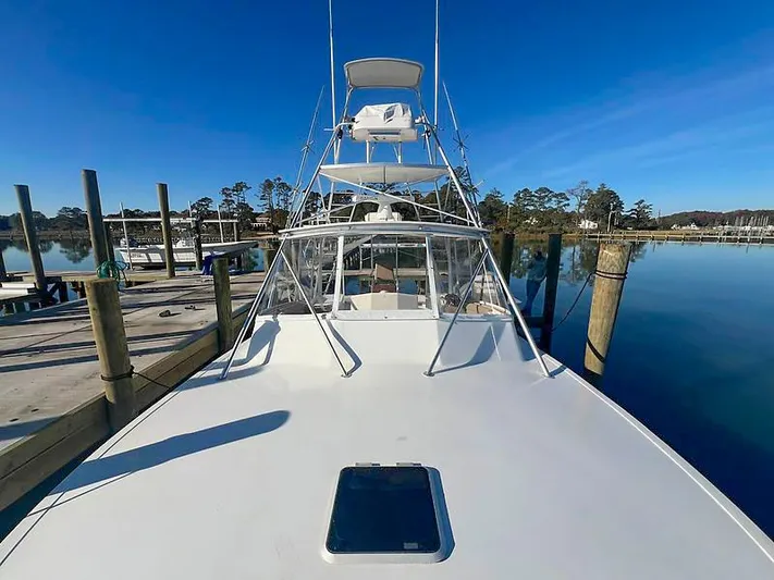 Precedent Yacht Photos Pics 1998 Jersey Cape 36 Express at dock, calm waters.