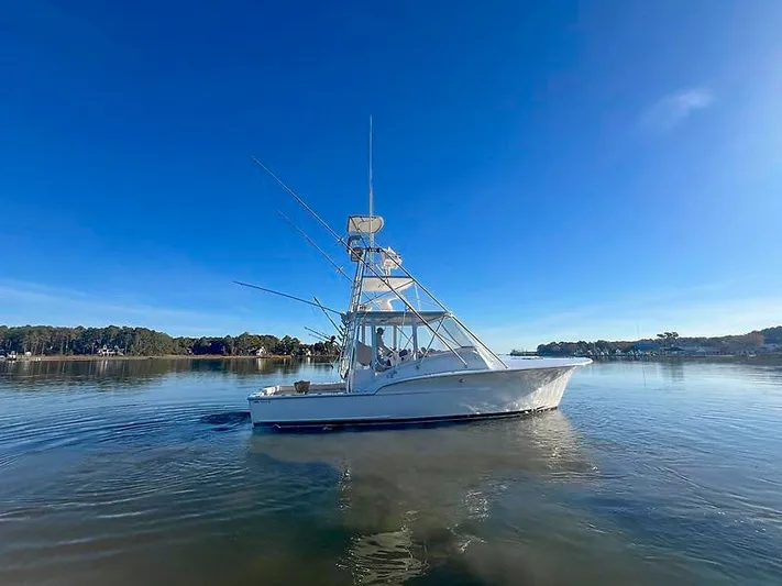 Precedent Yacht Photos Pics 1998 Jersey Cape 36 Express boat on calm water.