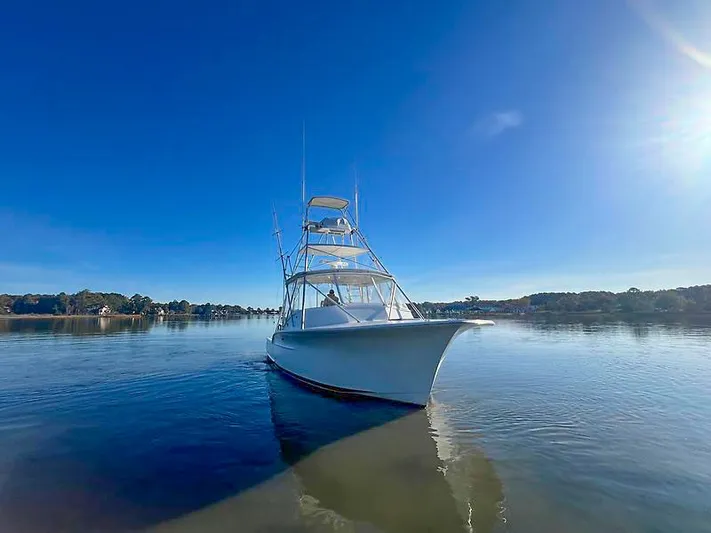 Precedent Yacht Photos Pics Jersey Cape 36 Express 1998 on calm water under sunny sky.
