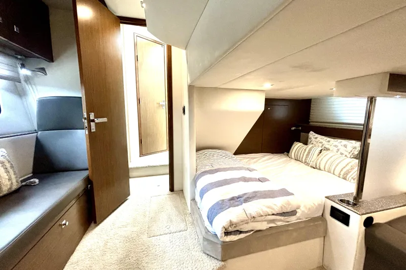  Yacht Photos Pics Interior of 2014 Cruisers Yachts 45 Cantius, featuring cozy bedroom and seating area.