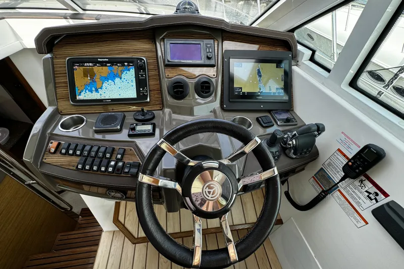  Yacht Photos Pics Helm of 2014 Cruisers Yachts 45 Cantius with navigation screens and controls.