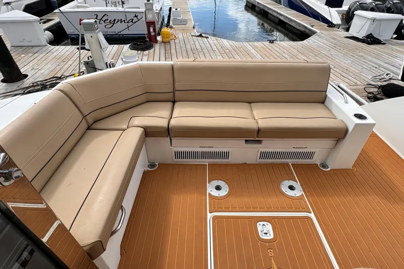  Yacht Photos Pics Luxurious seating on 2014 Cruisers Yachts 45 Cantius, docked with teak flooring.