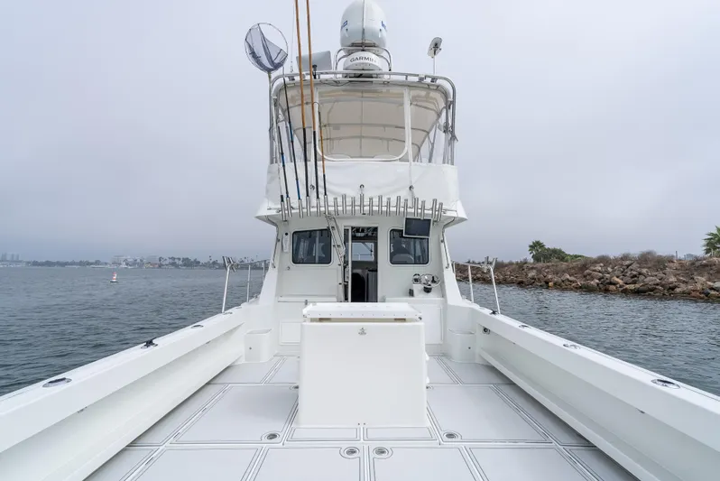  Yacht Photos Pics 2018 Lindell 46 F boat on calm water, overcast sky.