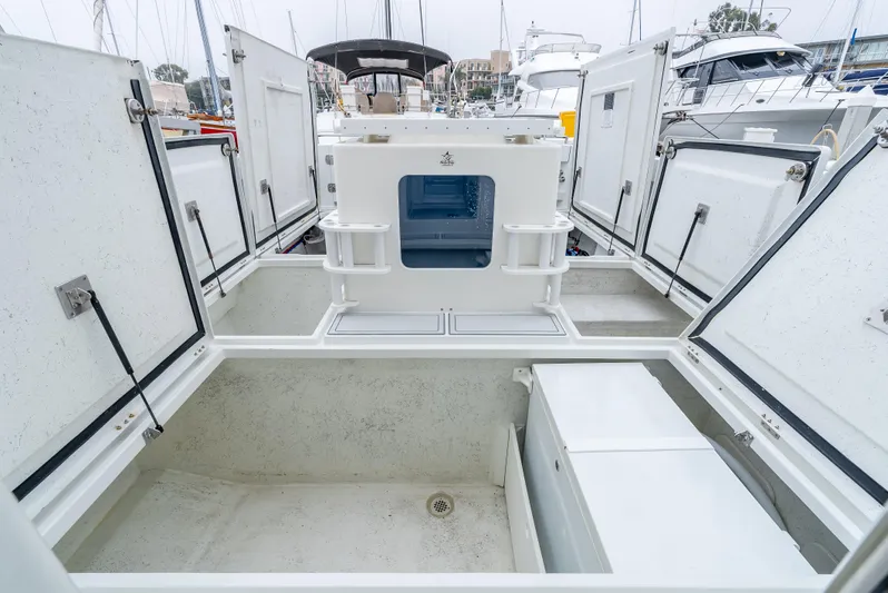  Yacht Photos Pics Open storage compartments on 2018 Lindell 46 F boat deck.