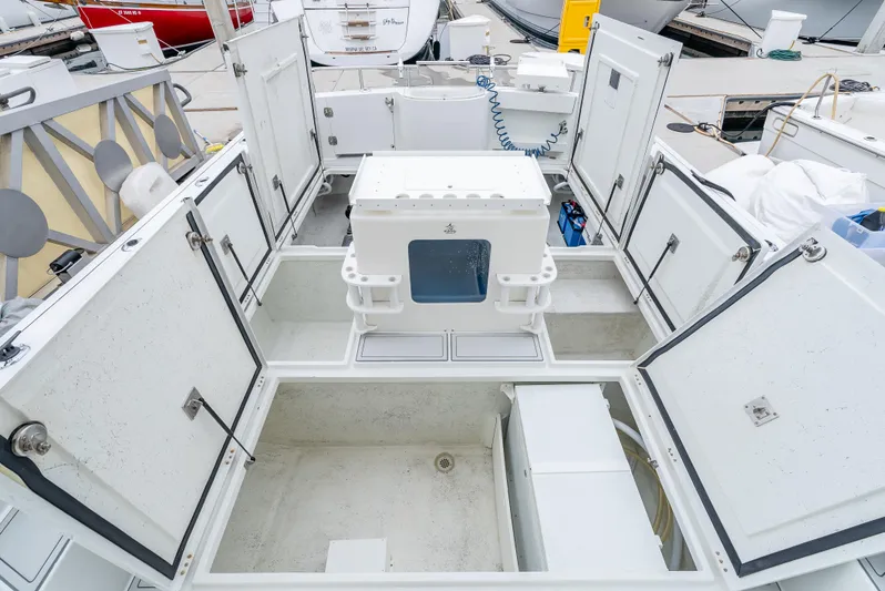  Yacht Photos Pics Open storage compartments on a 2018 Lindell 46 F boat deck.