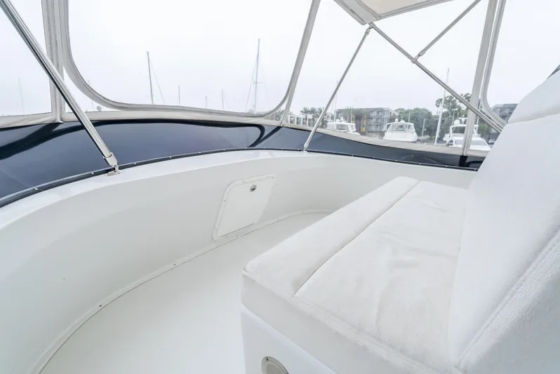  Yacht Photos Pics Interior view of 2018 Lindell 46 F boat with white seating and windows.