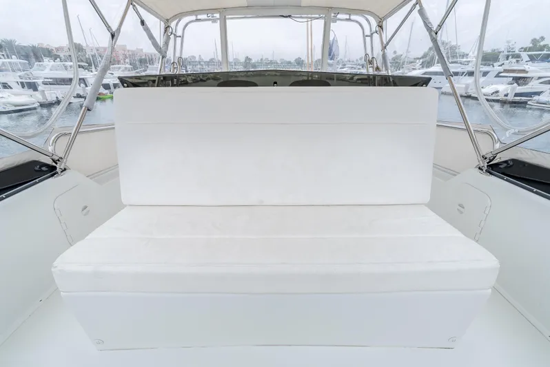  Yacht Photos Pics White seating area on 2018 Lindell 46 F yacht, docked in marina.