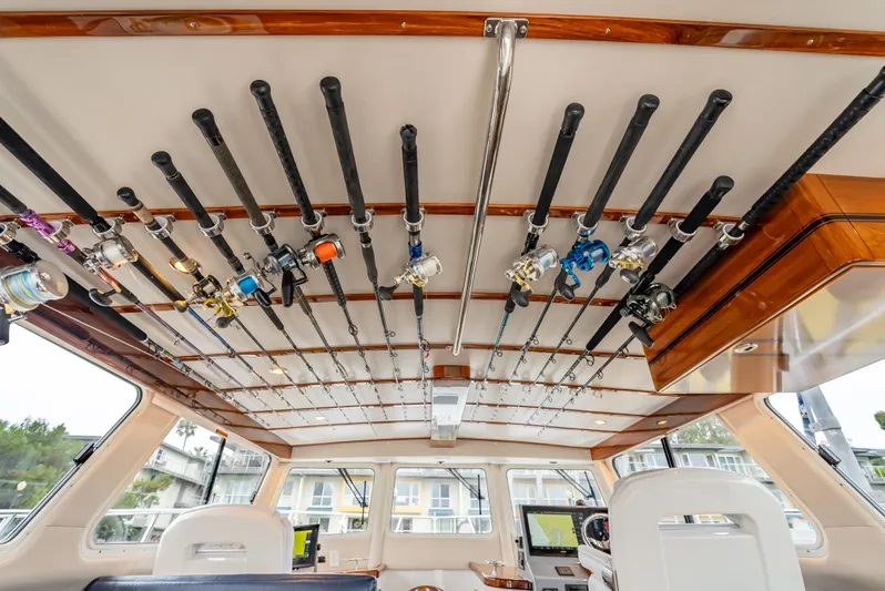  Yacht Photos Pics Interior of 2018 Lindell 46 F boat with fishing rods on ceiling rack.