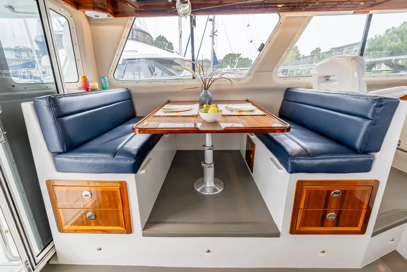  Yacht Photos Pics Luxurious interior of 2018 Lindell 46 F yacht with elegant dining area.