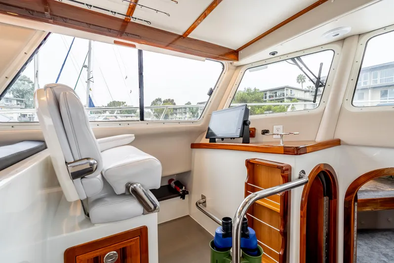  Yacht Photos Pics Interior of 2018 Lindell 46 F boat with helm station and seating.