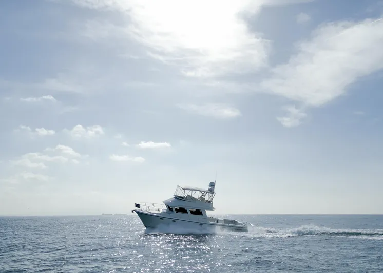 Yacht Photos Pics Lindell 46 F boat cruising on open sea under a bright sky, 2018 model.