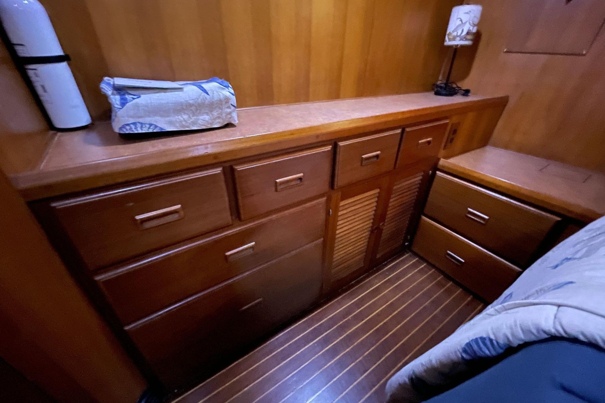 Wooden interior of 1986 NOVA MARINE 36 Sundeck with drawers and storage.