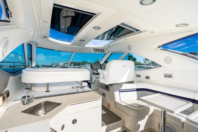  Yacht Photos Pics Luxurious interior of 2009 Sea Ray 470 Sundancer yacht with modern amenities and panoramic windows.
