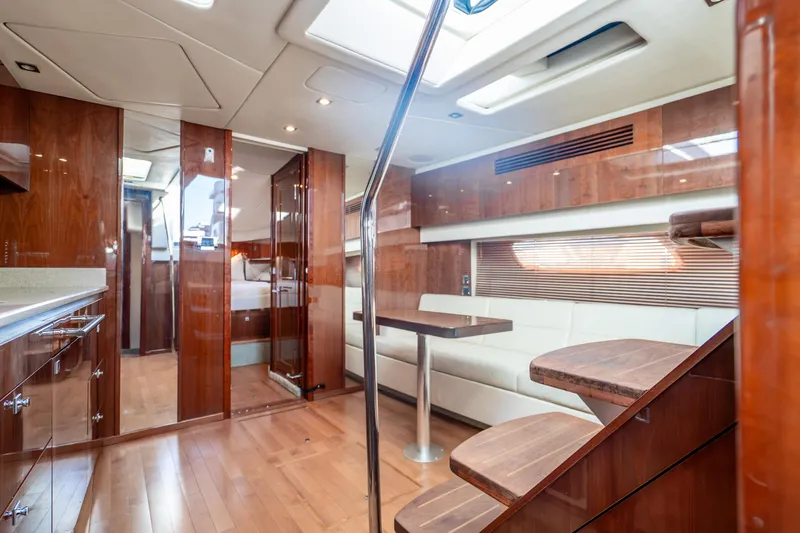 Yacht Photos Pics Luxurious interior of 2009 Sea Ray 470 Sundancer yacht with wood finishes and modern seating.
