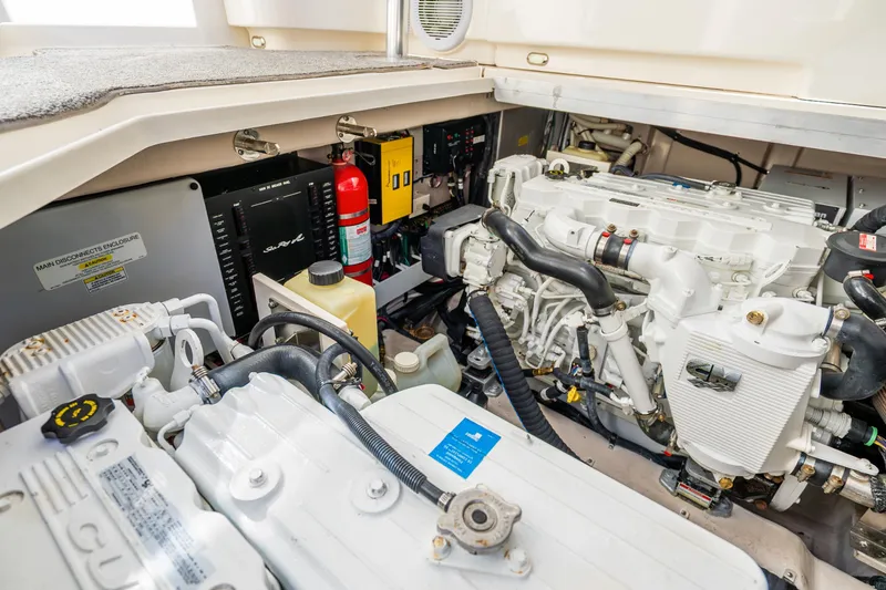  Yacht Photos Pics Engine room of 2009 Sea Ray 470 Sundancer yacht, showcasing mechanical components and fire extinguisher.