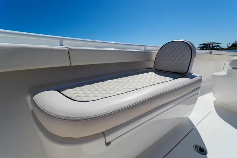 Sea Dawg Yacht Photos Pics 2024 Valhalla Boatworks V-33, featuring luxurious quilted seating under a clear blue sky.