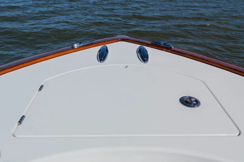 Sea Dawg Yacht Photos Pics 2024 Valhalla Boatworks V-33 bow detail on calm water.