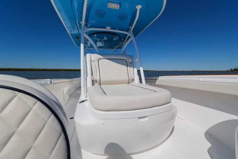 Sea Dawg Yacht Photos Pics 2024 Valhalla Boatworks V-33 with luxurious seating, under a clear blue sky.