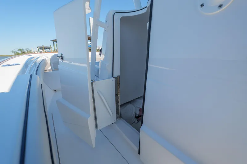 Sea Dawg Yacht Photos Pics 2024 Valhalla Boatworks V-33 cabin entrance with open door, showcasing sleek design.