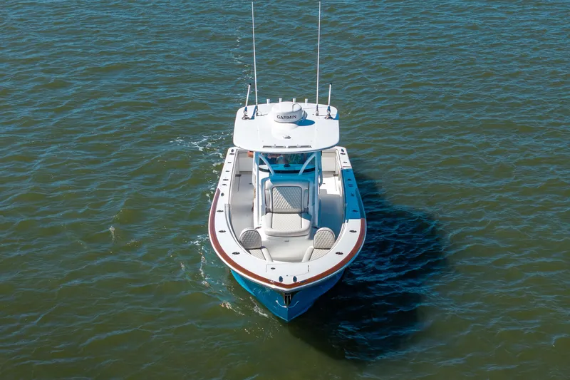 Sea Dawg Yacht Photos Pics 2024 Valhalla Boatworks V-33 on water, aerial view, sleek design.