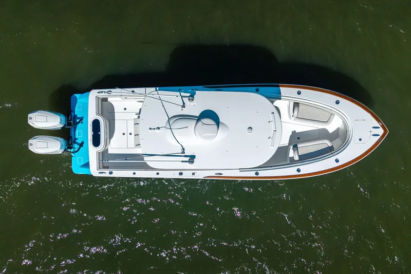 Sea Dawg Yacht Photos Pics Overhead view of 2024 Valhalla Boatworks V-33 on water, showcasing sleek design and dual engines.