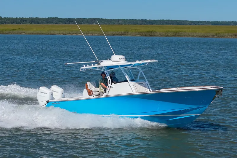 Sea Dawg Yacht Photos Pics 2024 Valhalla Boatworks V-33 cruising on water, featuring twin Mercury engines.