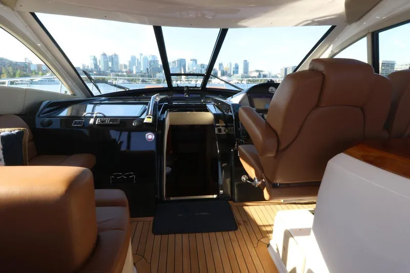 Blue Stiel Yacht Photos Pics Interior of 2009 Regal 52 Sport Coupe yacht with city skyline view.