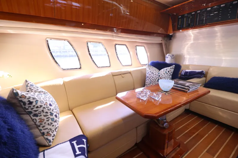 Blue Stiel Yacht Photos Pics Luxurious interior of 2009 Regal 52 Sport Coupe yacht with plush seating and elegant decor.