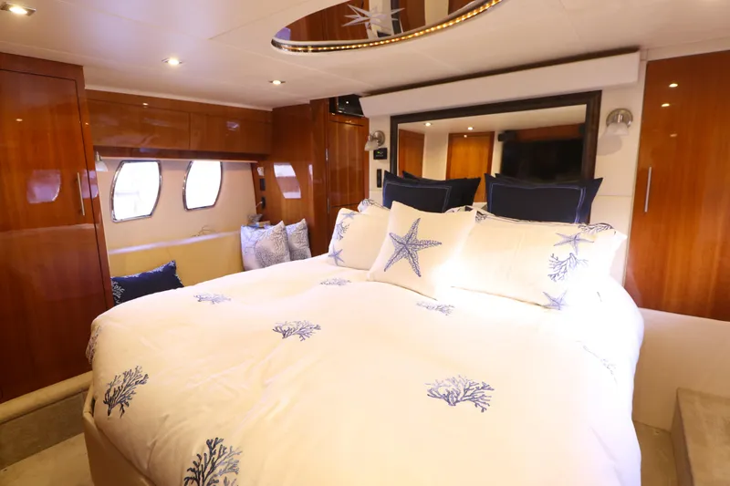 Blue Stiel Yacht Photos Pics Luxurious bedroom interior of 2009 Regal 52 Sport Coupe yacht with nautical-themed bedding.