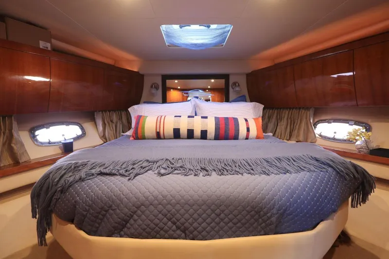 Blue Stiel Yacht Photos Pics Luxurious cabin interior of 2009 Regal 52 Sport Coupe yacht with cozy bedding.